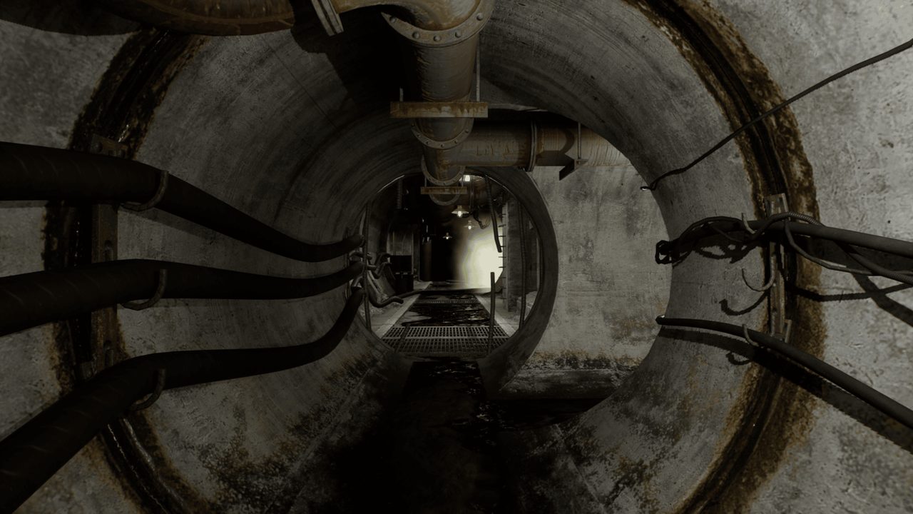 A concrete service tunnel lined with pipes and cables
